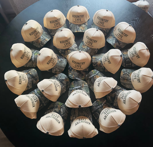 Kountry Lyfe “From The Sticks” Camo Trucker Hat