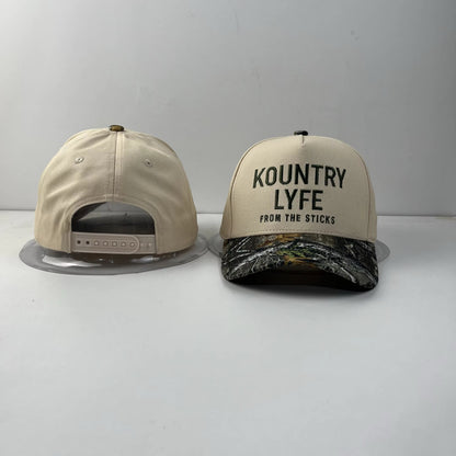 Kountry Lyfe “From The Sticks” Camo Trucker Hat